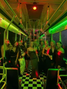 Group celebration inside a vibrant bus.